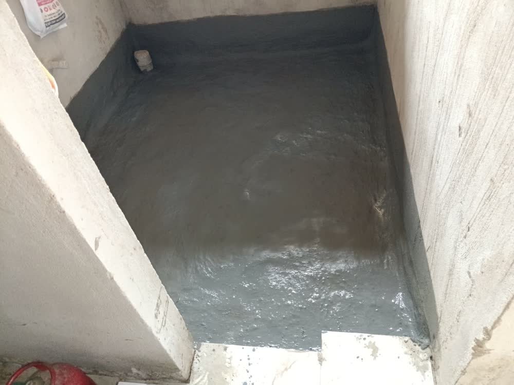 Real bathroom sunken slab waterproofing coating with pipe collar seals by Sarfaraz Ahmad in Chandigarh